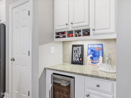 a view of a hallway with a window and stairs