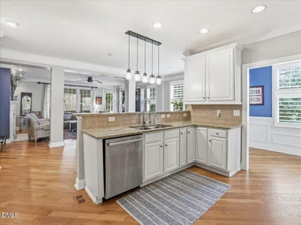 a spacious bathroom with a granite countertop tub sink and glass door