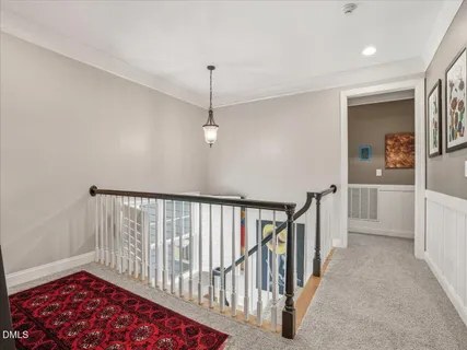 a view of a garden with plants and large trees