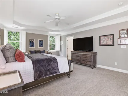 a street sign that is sitting on a brick wall