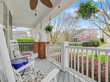 a living room with furniture fireplace and a window