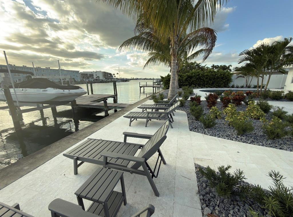 12350 4th Street East Treasure Island, FL 33706 - Photo 12 of 16 a view of a terrace with furniture and a garden
