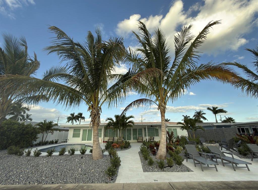 12350 4th Street East Treasure Island, FL 33706 - Photo 14 of 16 a swimming pool with outdoor seating