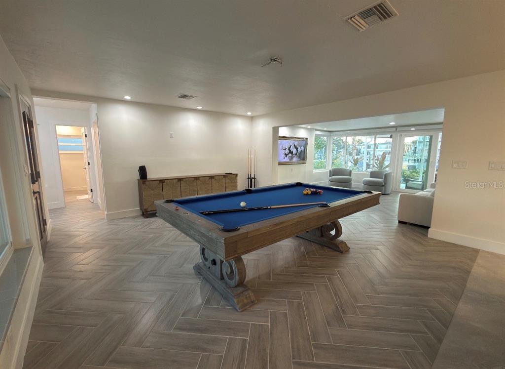 12350 4th Street East Treasure Island, FL 33706 - Photo 5 of 16 a room with pool table and windows
