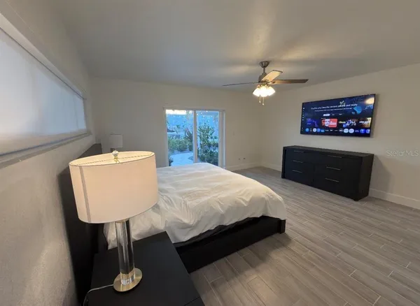 a bathroom with double vanity and a mirror