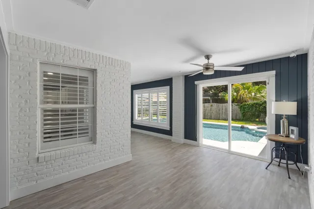 a view of livingroom with furniture wooden floor and fan