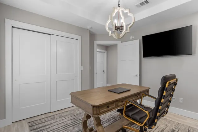 a view of a room that has a table and chairs in it