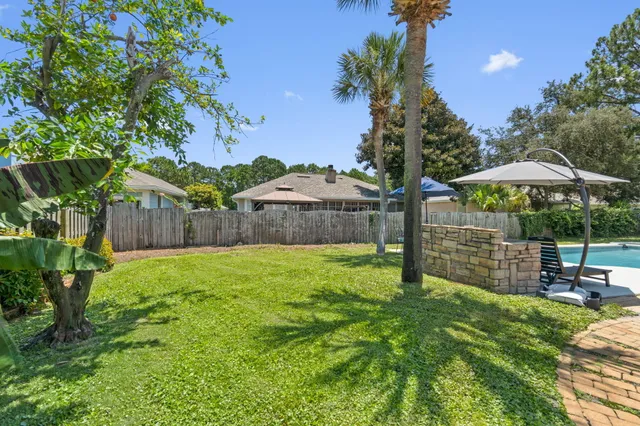 a backyard of a house with lots of green space