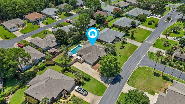 an aerial view of multiple houses with swimming pool