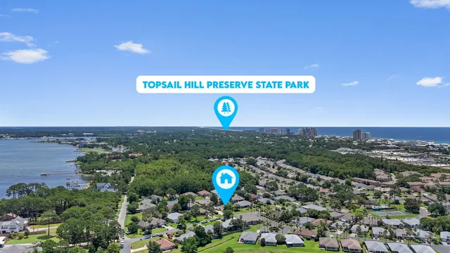 a view of a house with swimming pool and a small yard