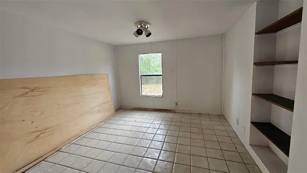 a view of an empty room and window