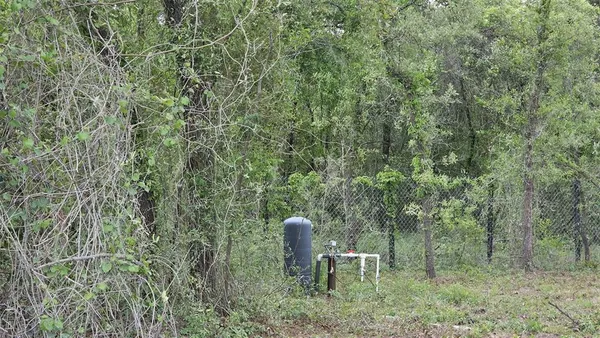 a view of a chair and table in the yard