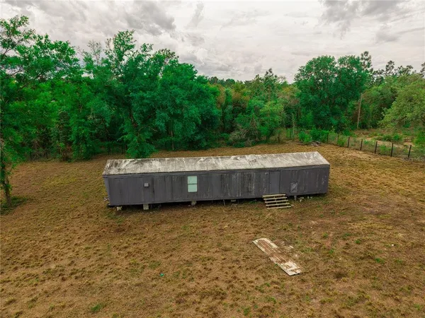 a view of a couches in backyard of house