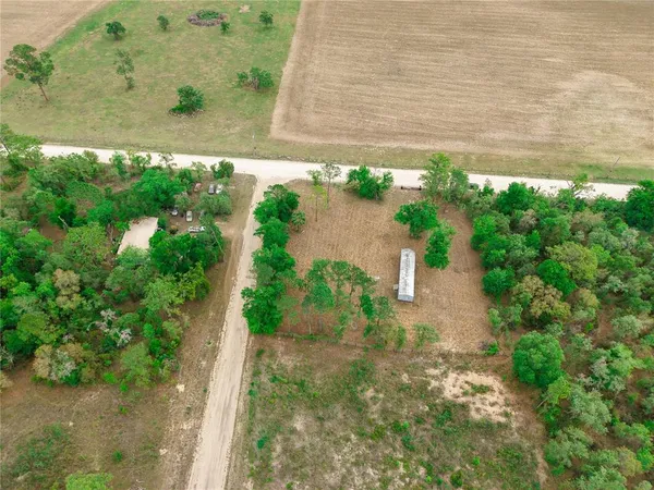 an aerial view of residential house with outdoor space
