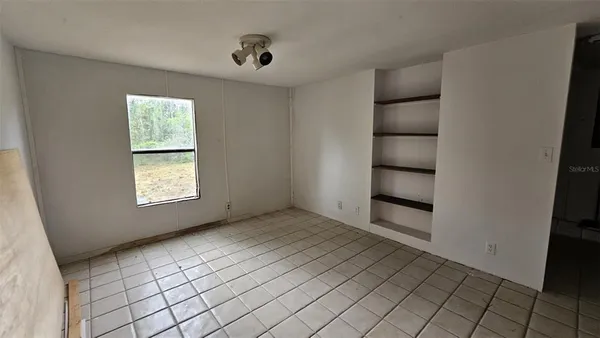 a view of an empty room and window