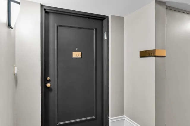 walk in closet with window and outdoor view