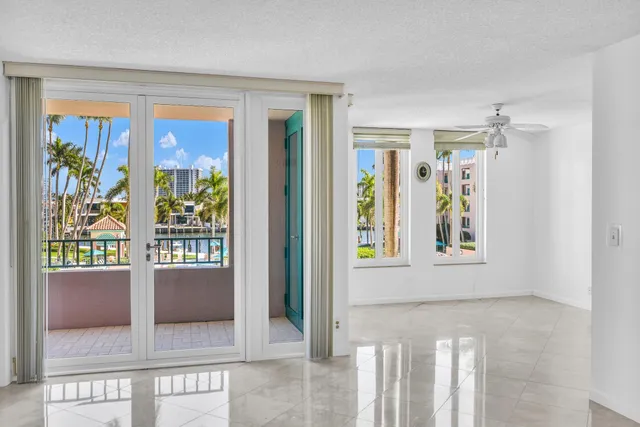 an empty room with windows and outdoor view