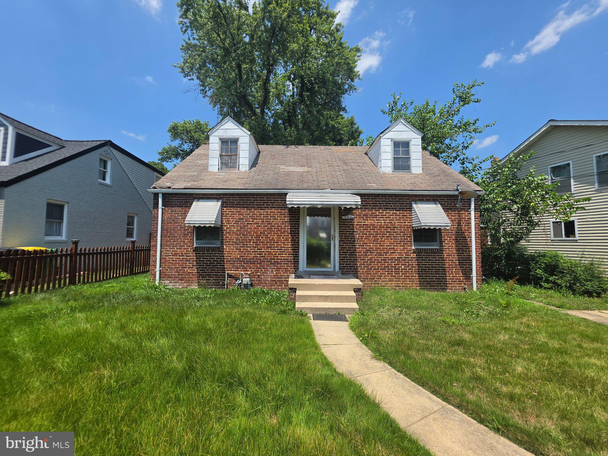 2312 Amherst Road Hyattsville, MD 20783 - Photo 1 of 1 Charming brick home with lush greenery.