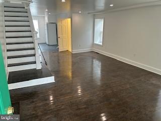a view of entryway with wooden floor