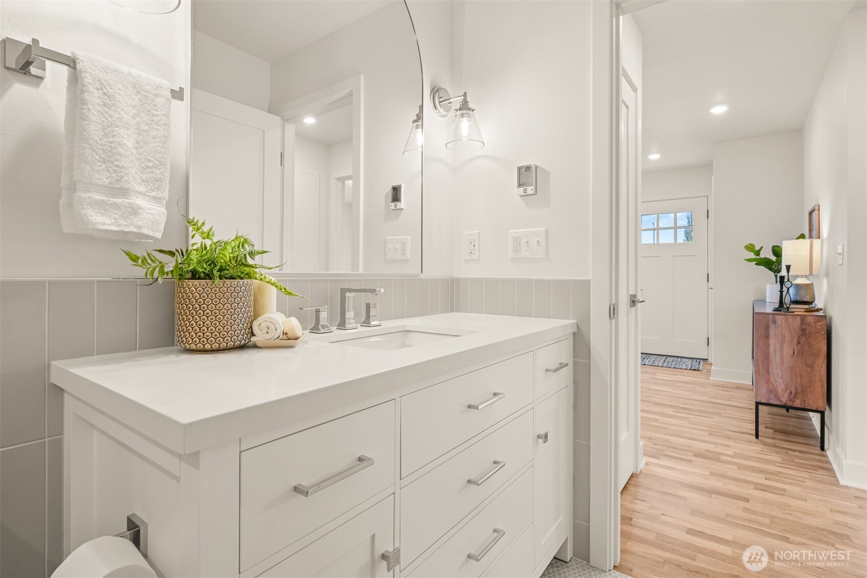 2111 Franklin Street Bellingham, WA 98225 - Photo 14 of 39 a bathroom with a sink a mirror and a shower