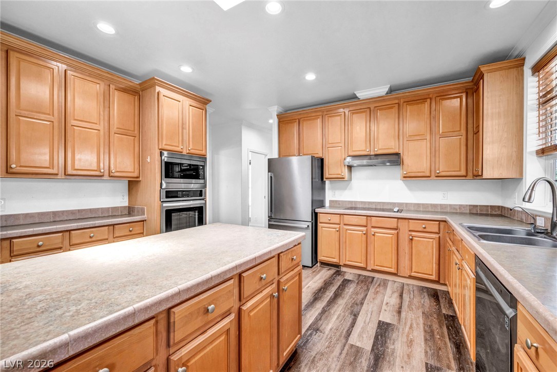 225 California Street Searchlight, NV 89046 - Photo 21 of 64 A well-lit culinary space showcases an island with ample counter space and abundant cabinetry.