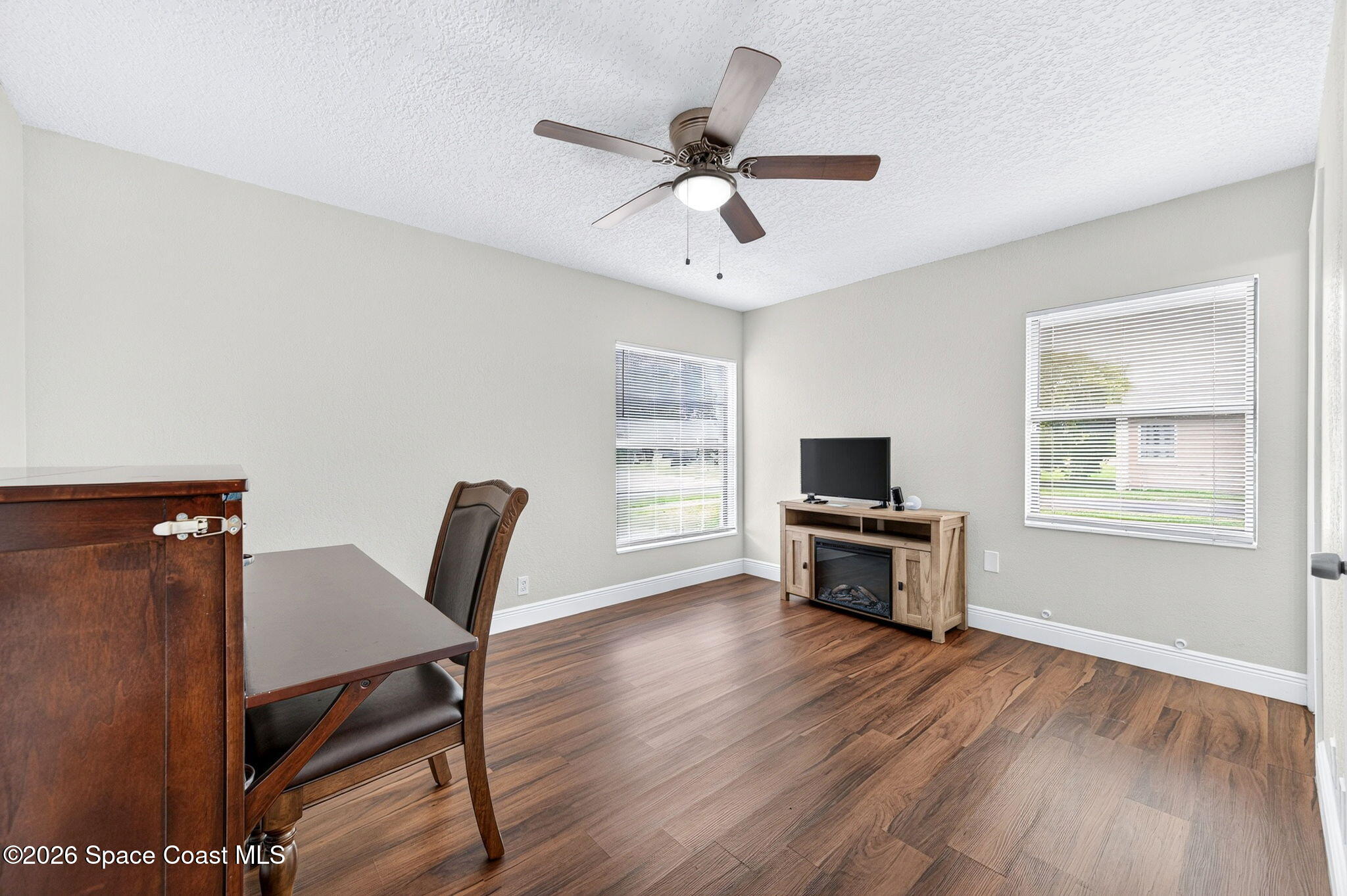 996 Botany Lane Rockledge, FL 32955 - Photo 21 of 35 a living room with furniture wooden floor and a window