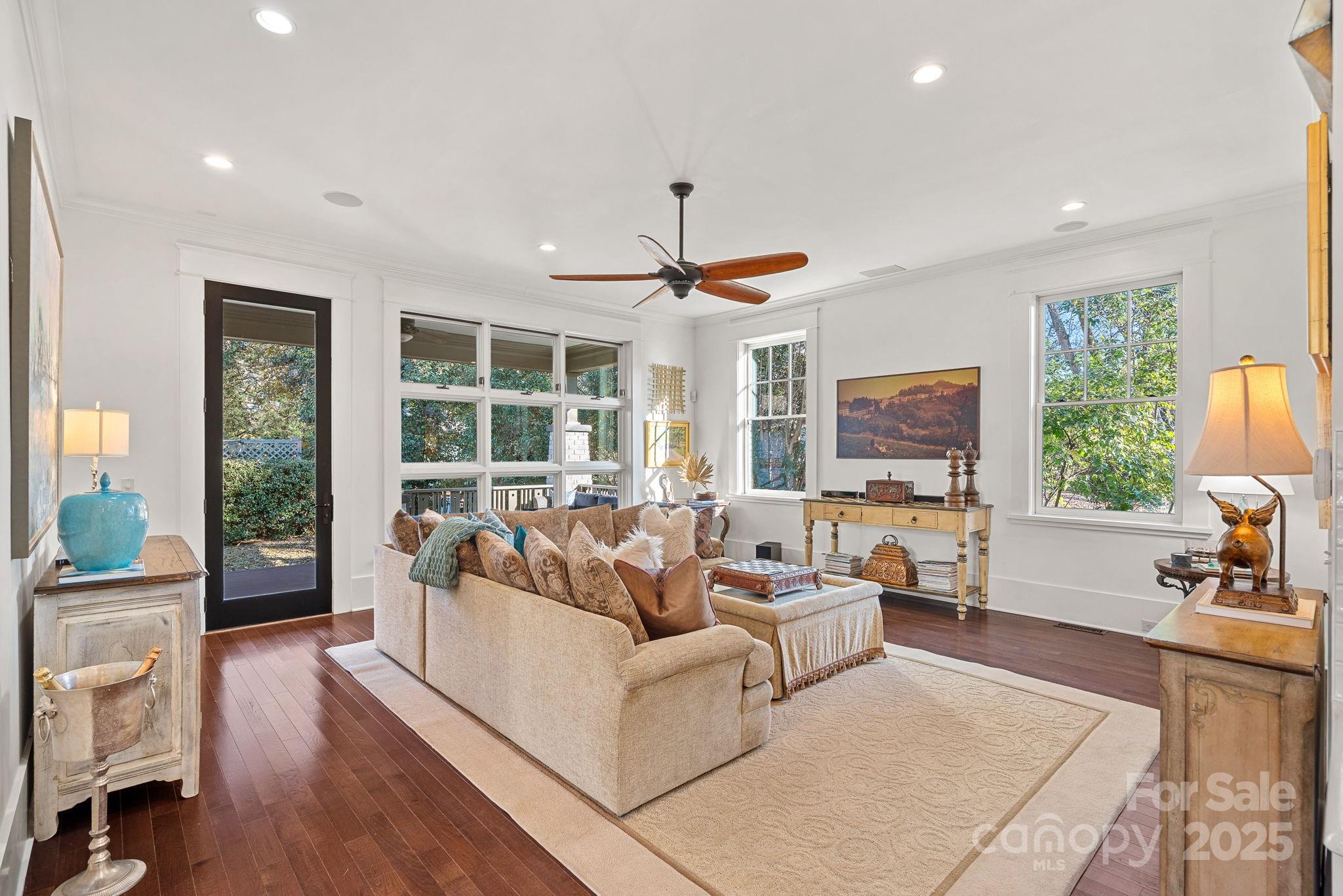 206 Meadowbrook Road Charlotte, NC 28211 - Photo 15 of 48 a living room with furniture a large window and a flat screen tv
