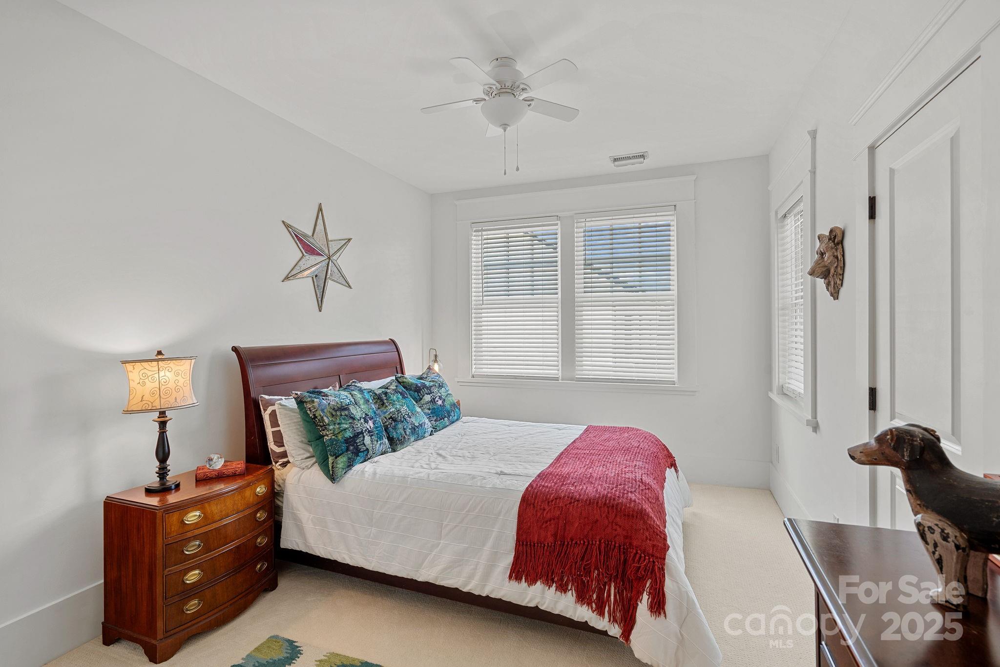 206 Meadowbrook Road Charlotte, NC 28211 - Photo 28 of 48 a bedroom with a bed and a window