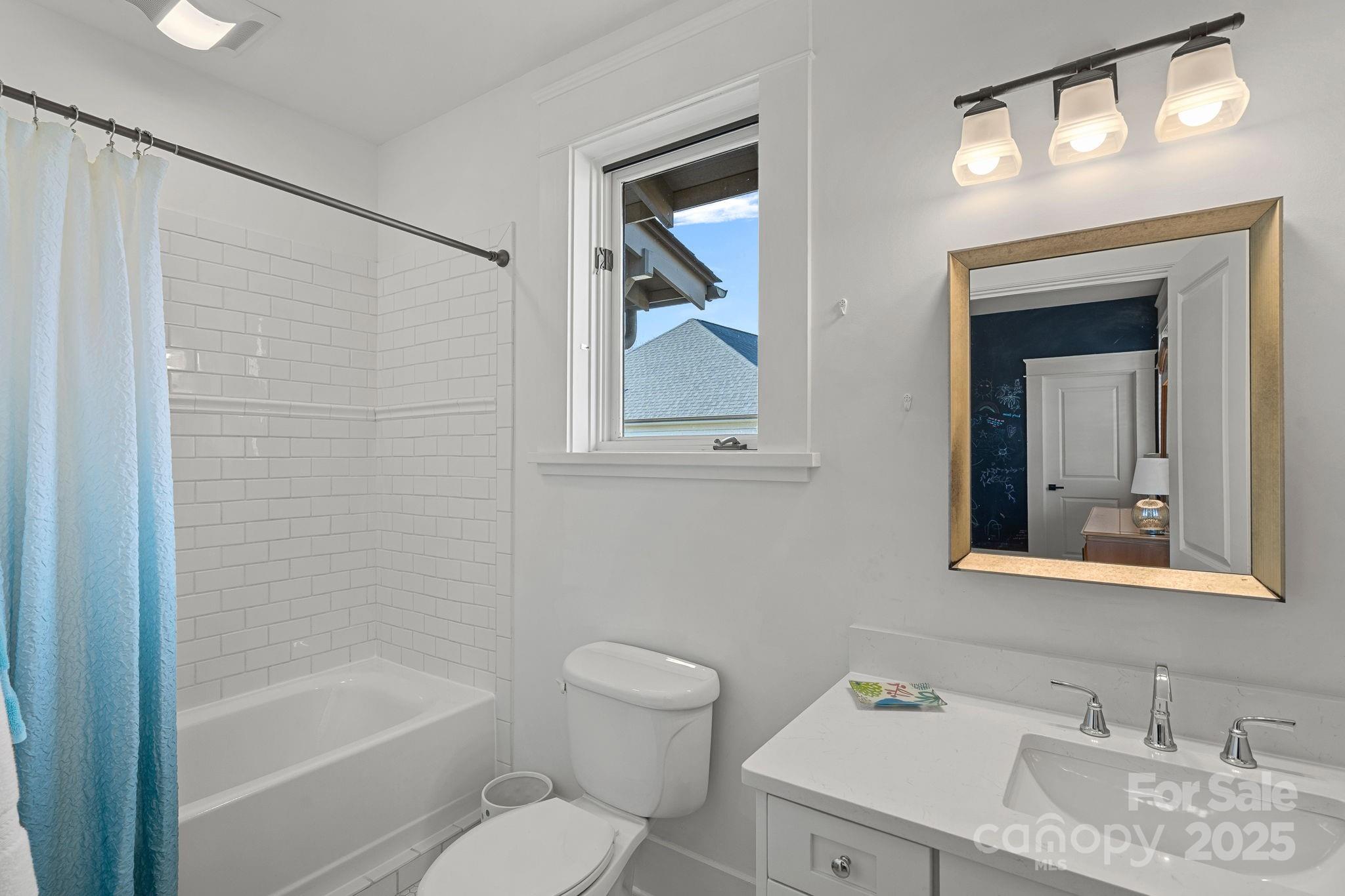 206 Meadowbrook Road Charlotte, NC 28211 - Photo 30 of 48 a bathroom with a granite countertop sink toilet and mirror