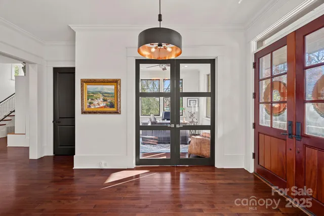 wooden floor in an empty room with a window and wooden floor