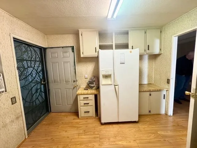 a kitchen with stainless steel appliances a refrigerator and a stove