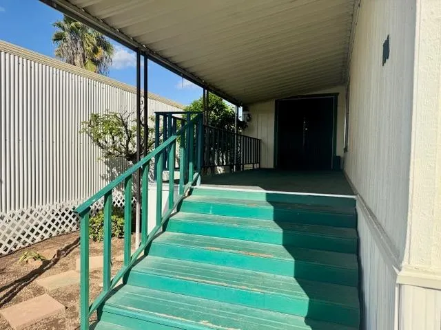 a view of stairs and flowers