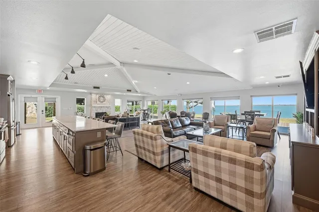 a view of a swimming pool with a patio and a yard