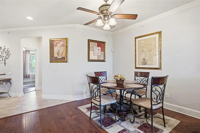 a view of a dining room with furniture wooden floor and a chandelier
