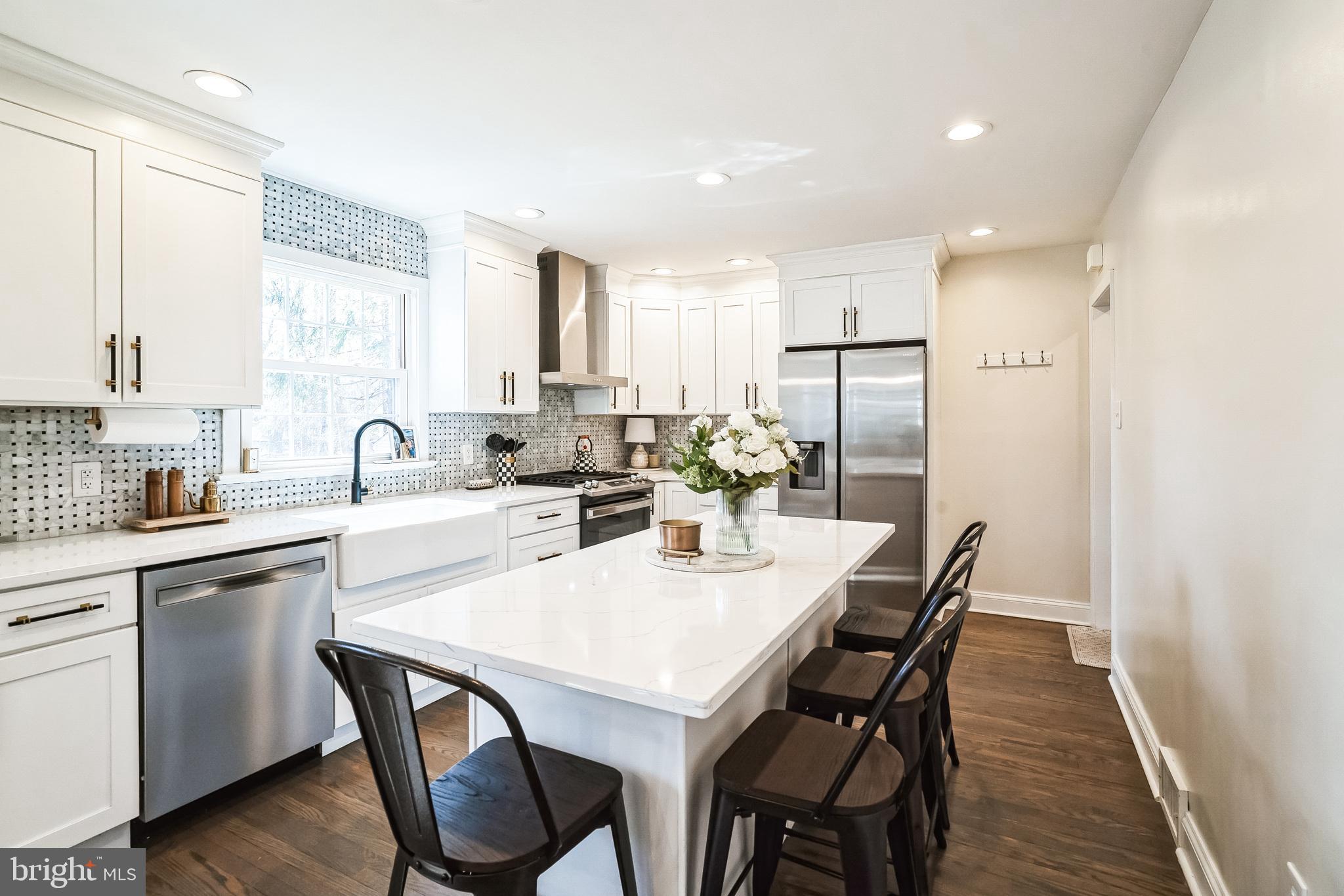 306 Cowpath Road Lansdale, PA 19446 - Photo 12 of 30 a kitchen with a dining table chairs and refrigerator