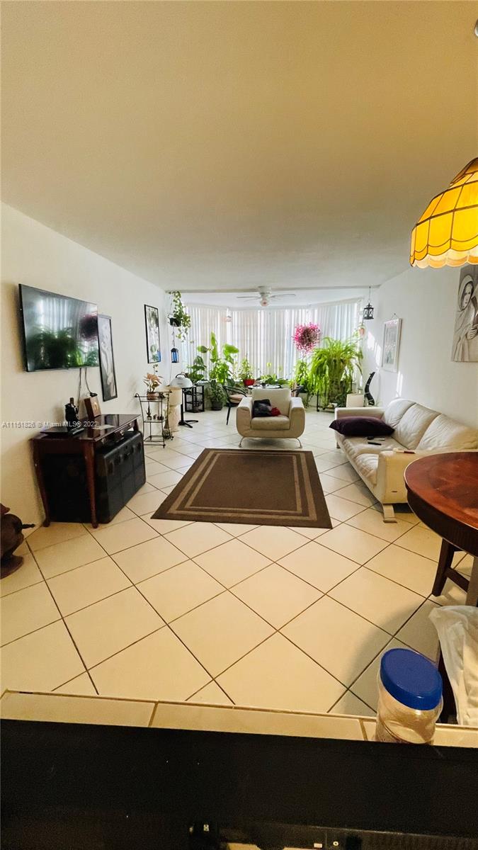 Second Forum Condominium North Miami Beach, FL 33179 - Photo 6 of 12 a kitchen with a sink a stove and a refrigerator