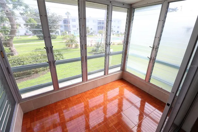 a view of an empty room with a large window