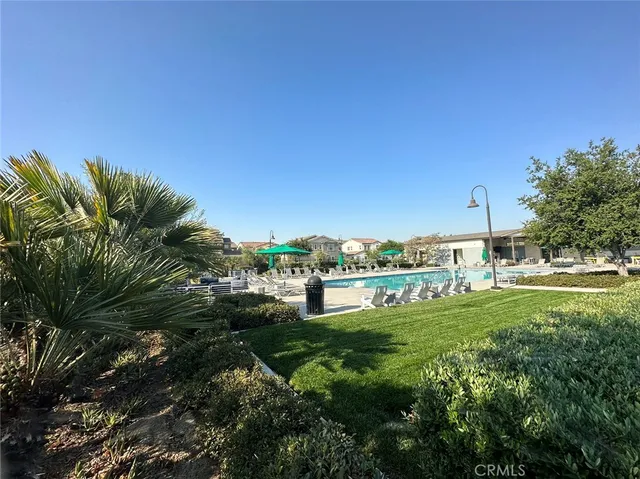 a view of a garden with a building in the background