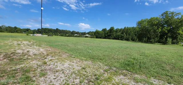 a view of a golf course with lots of green space