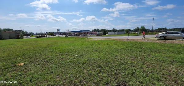 a view of a field with of trees
