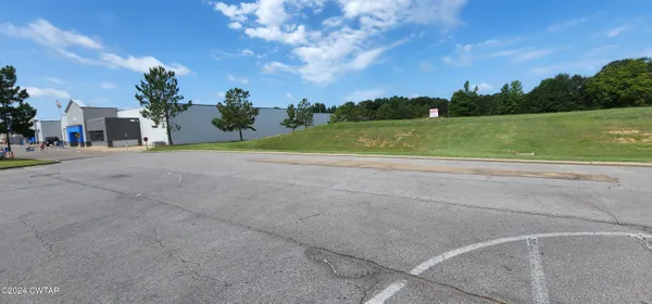 a view of a golf course with a lake