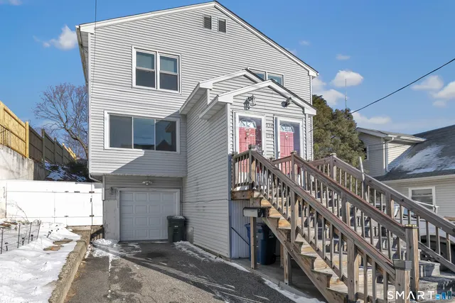 a view of a house with wooden stairs
