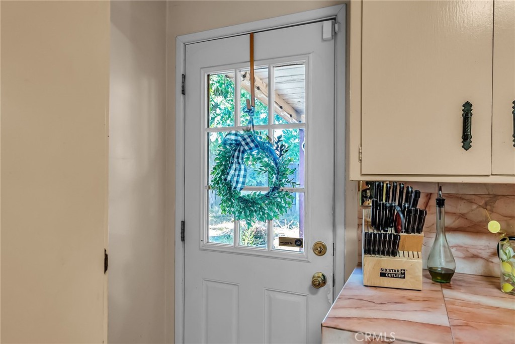 3085 Flanders Road Riverside, CA 92507 - Photo 11 of 23 a view of a balcony with wooden floor and front door
