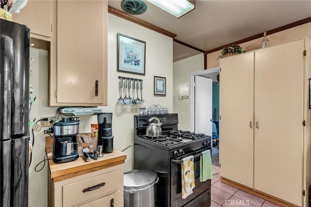 3085 Flanders Road Riverside, CA 92507 - Photo 13 of 23 a kitchen with stainless steel appliances a stove and a refrigerator