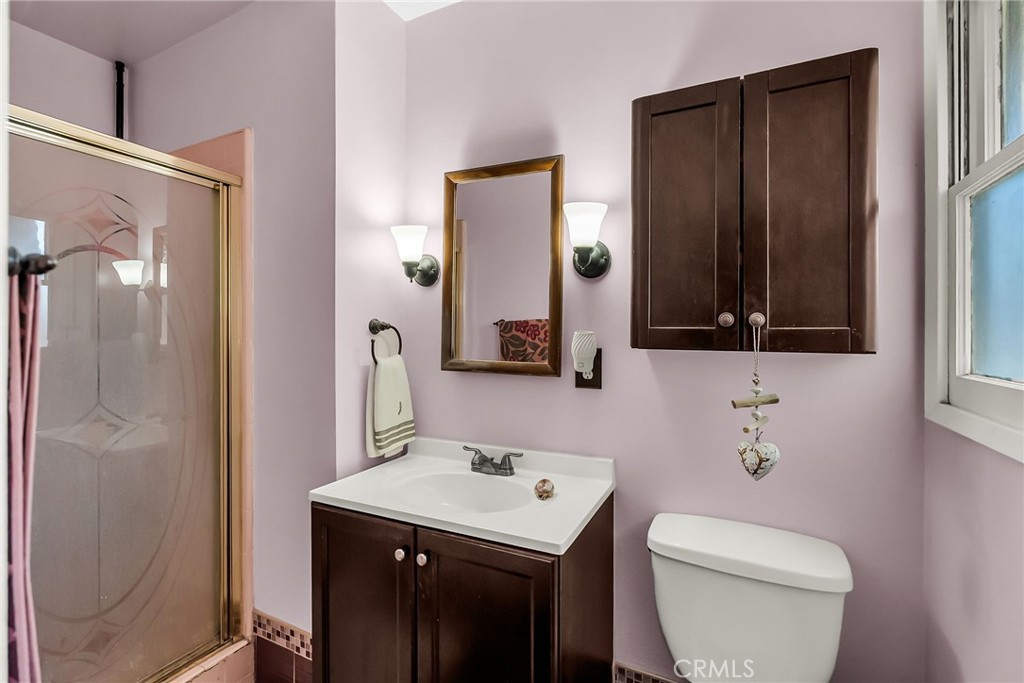 3085 Flanders Road Riverside, CA 92507 - Photo 15 of 23 a bathroom with a sink a toilet and shower