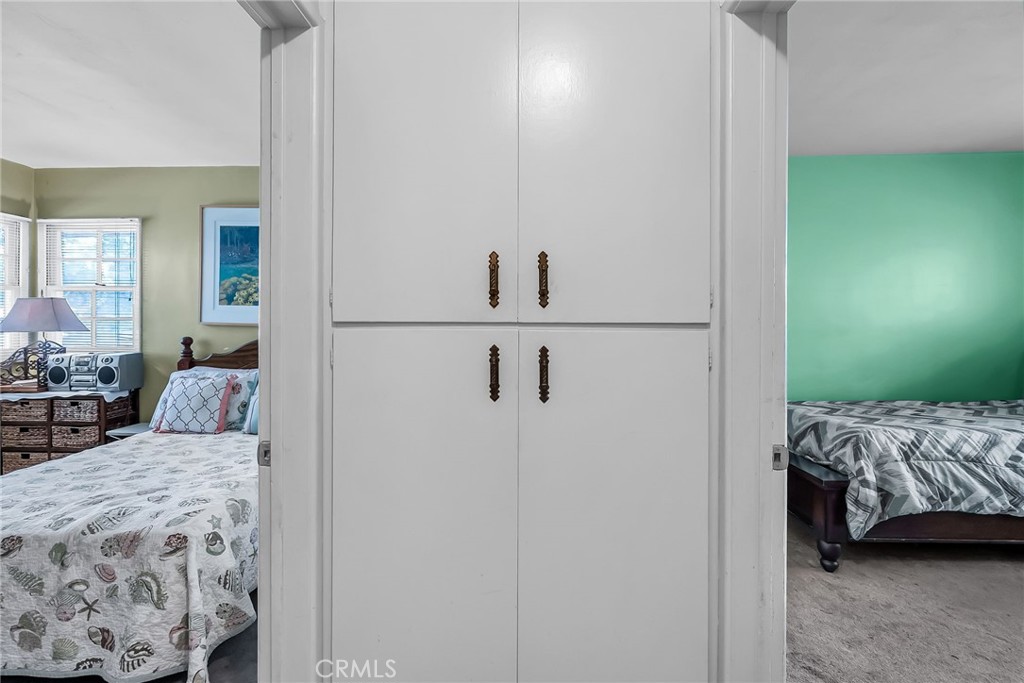 3085 Flanders Road Riverside, CA 92507 - Photo 16 of 23 a bedroom with a bed and a view of bathroom