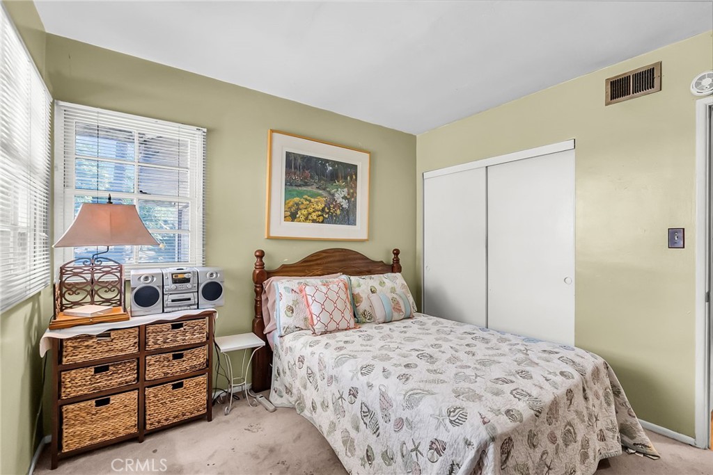 3085 Flanders Road Riverside, CA 92507 - Photo 18 of 23 a bedroom with a bed and a window