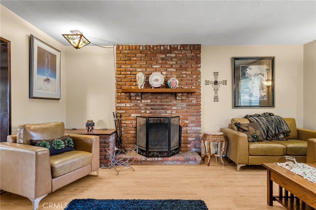 3085 Flanders Road Riverside, CA 92507 - Photo 21 of 23 a living room with furniture and a fireplace