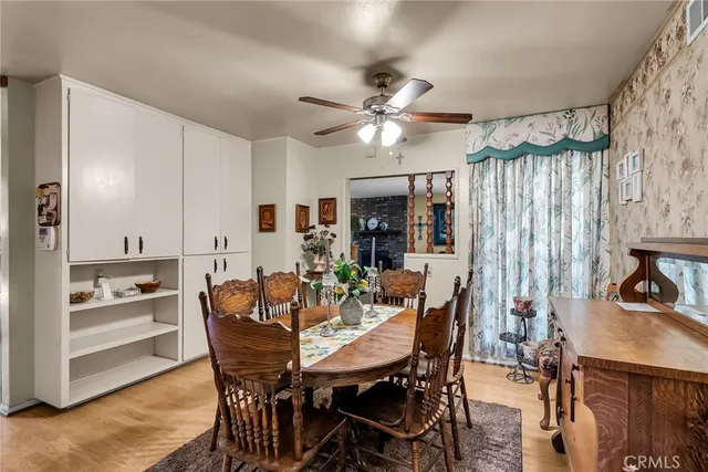 a view of a dining room with furniture and a chandelier