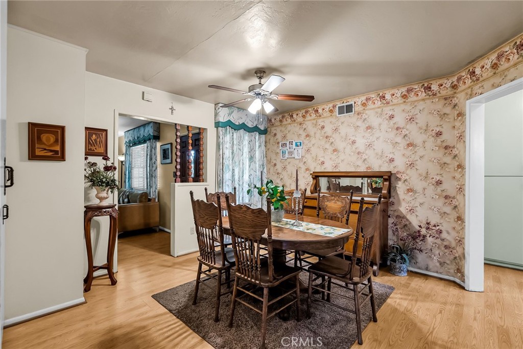 3085 Flanders Road Riverside, CA 92507 - Photo 10 of 23 a view of a dining room with furniture and chandelier